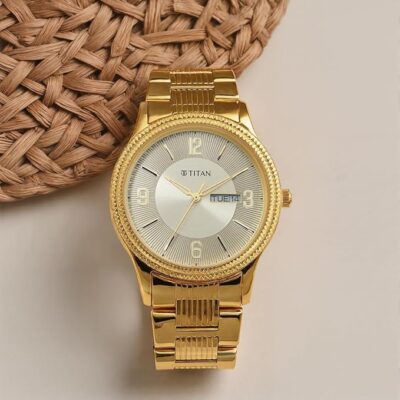 Titan Karishma Quartz Analog with Day and Date Champagne Dial Golden Stainless Steel Strap Watch for Men - NT1650YM09