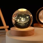 📦 Package Includes – 1 x 3D Crystal Ball Night Lamp with USB Connector, 6 LED Lights, Wooden Base, Warm White Glow. 📏 Size & Lighting Details – Crystal Ball: 6 cm | Wooden Base: 2 cm | Features 6 Warm White LEDs with convenient USB power supply. 🔮 Premium K10 Crystal Quality – Crafted from high-grade K10 crystal for exceptional transparency, purity, and zero bubbles or impurities. 🌌 Elegant Removable Night Light – A beautiful addition to bedrooms, living rooms, studies, or offices. Especially ideal for kids’ rooms or as a charming night lamp for stargazers and science lovers. 🎁 Ideal for All Gift Occasions – Makes a thoughtful gift for kids, teens, friends, boyfriends, girlfriends, teachers, and family. Perfect for birthdays, Valentine’s Day, anniversaries, Diwali, Christmas, New Year, Easter, Thanksgiving, housewarmings, and other festive occasions.
